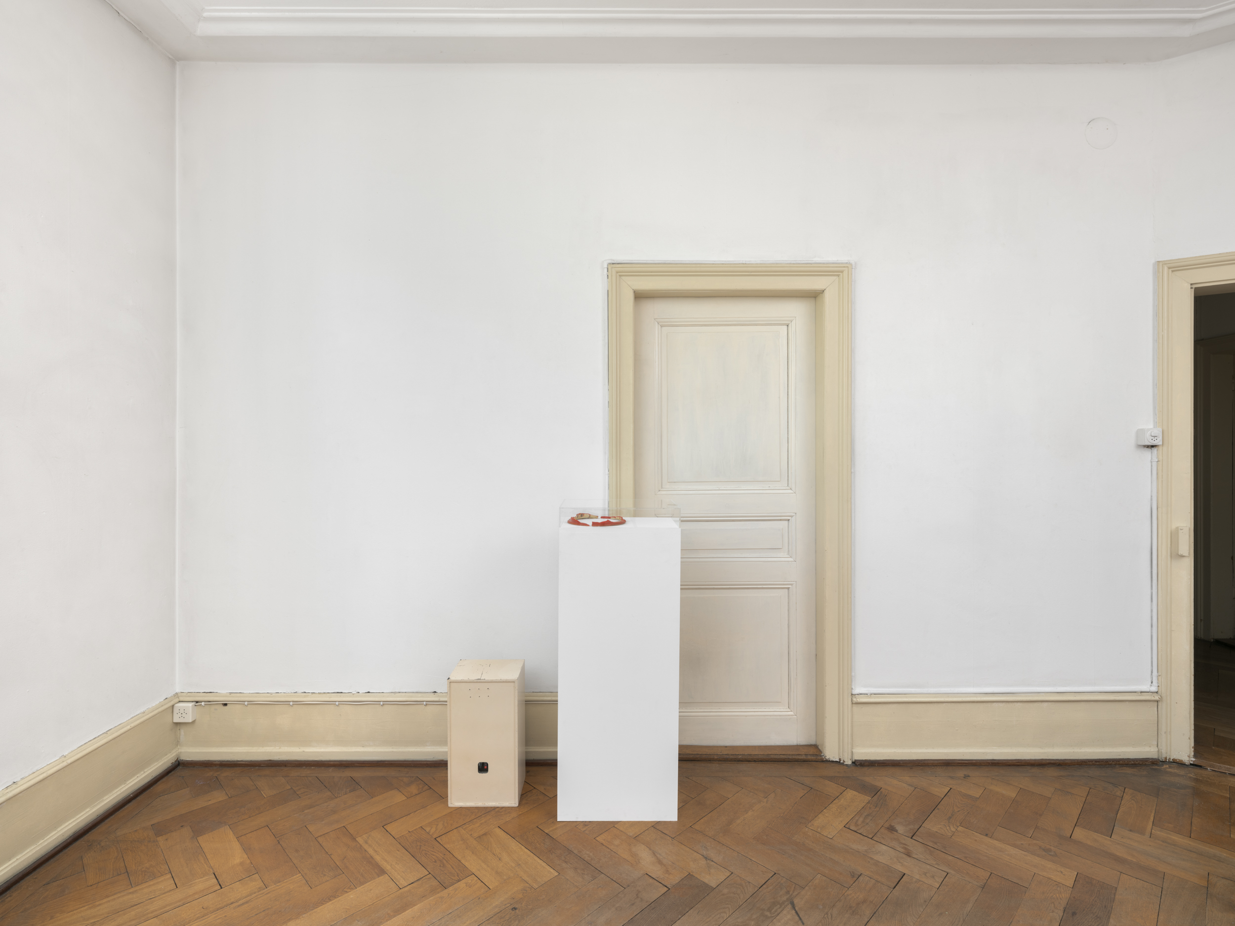 Aisha Altenhofen solo exhibition at Austin Space: Installation view of four small photographic works of a wood workshop.