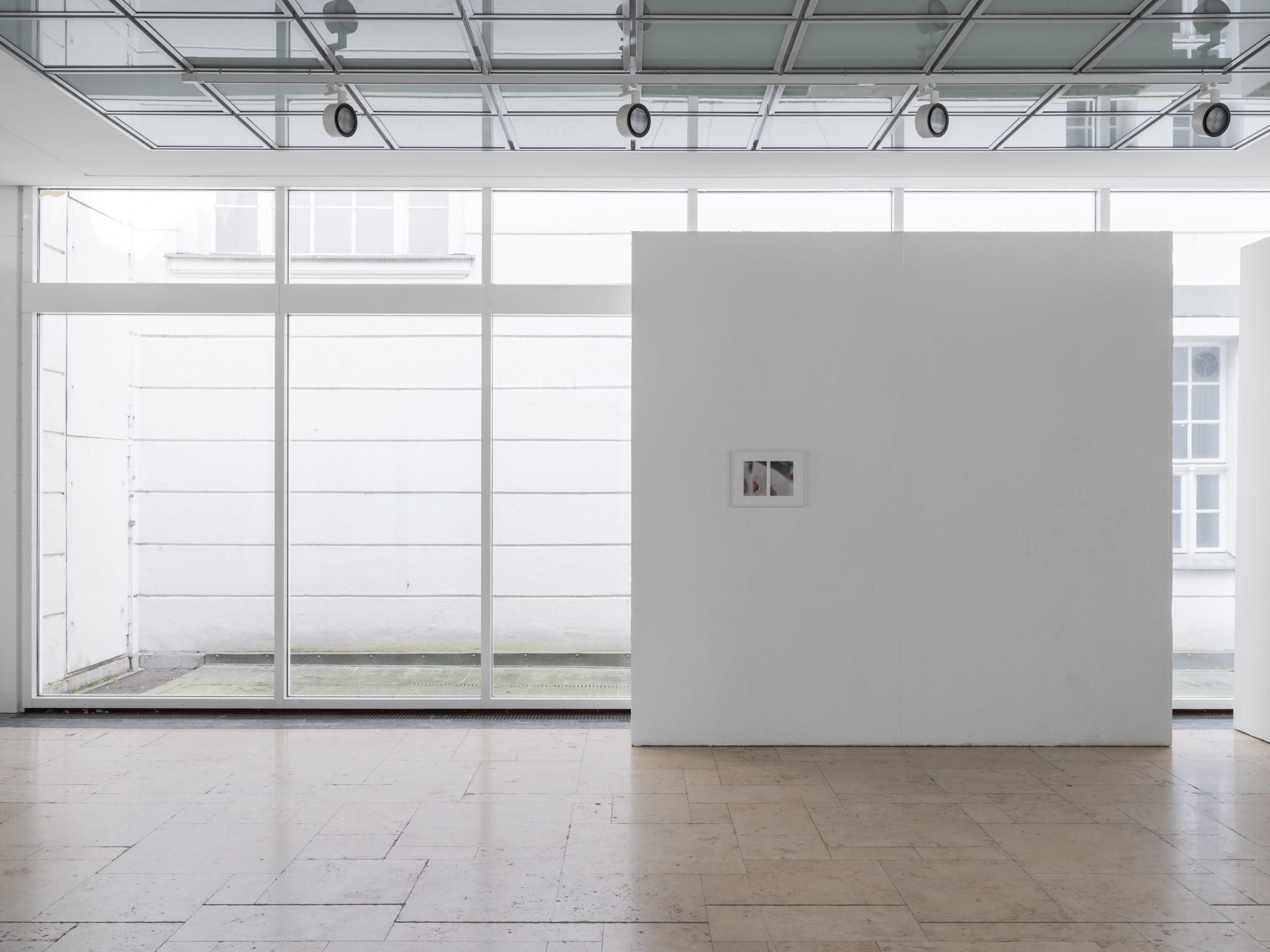 Aisha Altenhofen solo exhibition at Austin Space: Installation view of the grid light box installed across the window in the gallery space.
