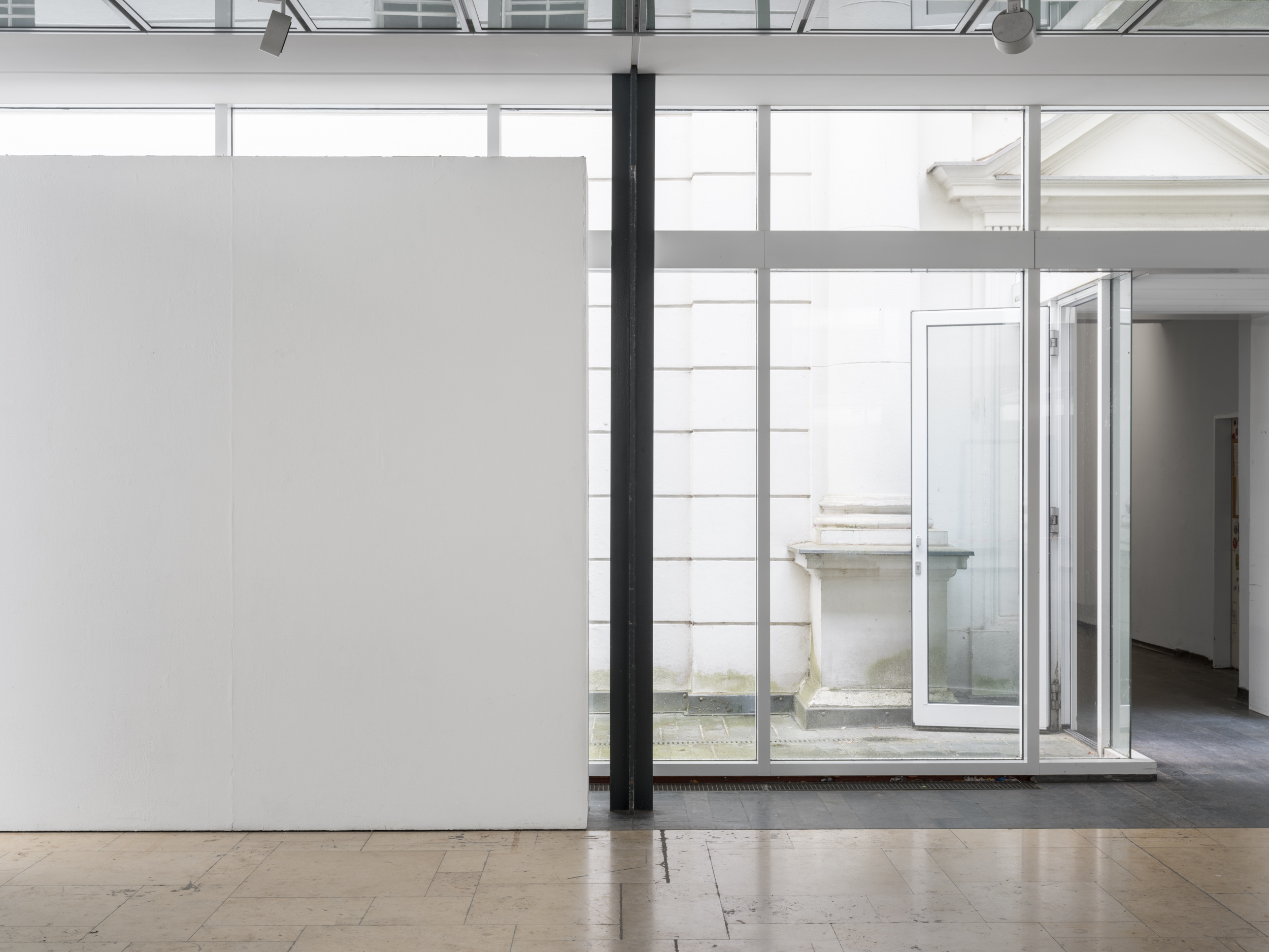 Aisha Altenhofen solo exhibition at Austin Space: Installation view of four small photographic works of a wood workshop.